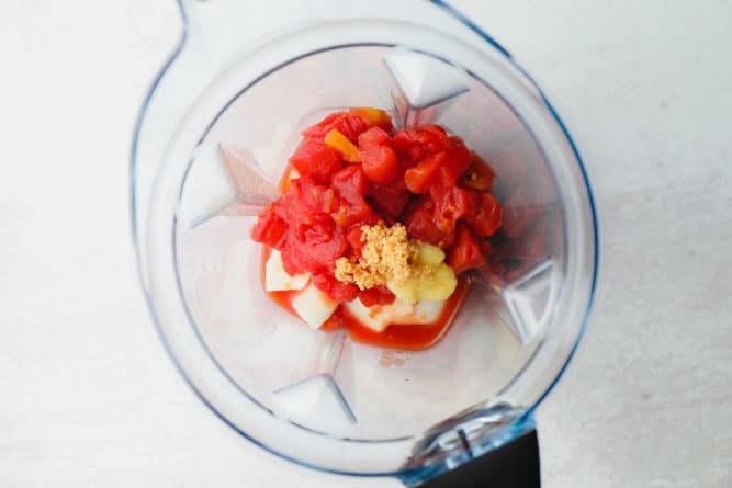 blender with tomatoes, garlic and ginger