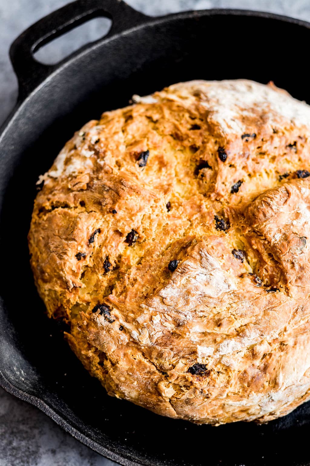 baked vegan Irish soda bread in a black cast iron pan.