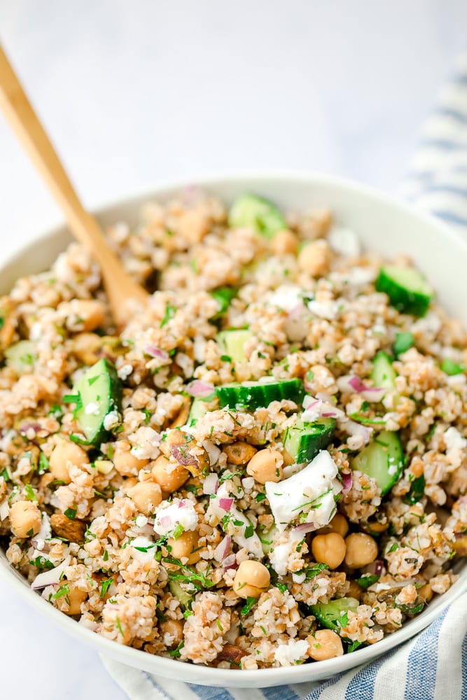 close up of a bowl of bulgur salad with cucumbers