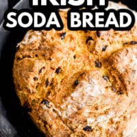 pinterest image of baked vegan irish soda bread in a cast iron pan.
