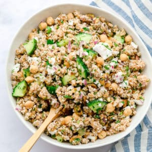 white bowl with grain salad, chickpeas and veggies