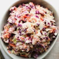 square image of a bowl of vegan coleslaw