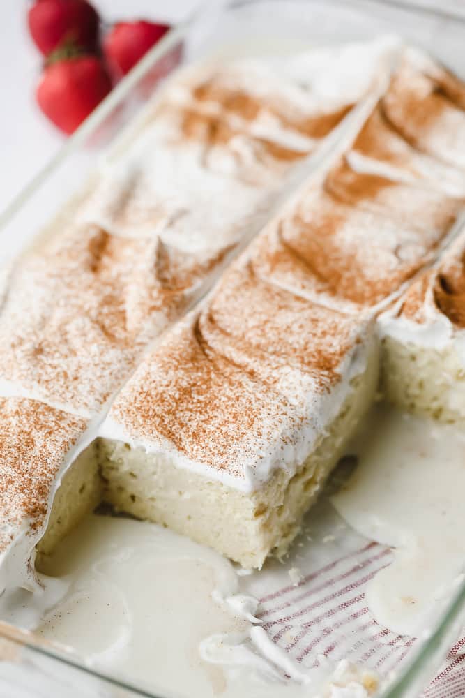 glass pan with a cake and milk mixture on the bottom