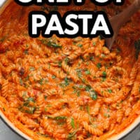 pinterest image of a white pot filled with pasta covered in tomato sauce.
