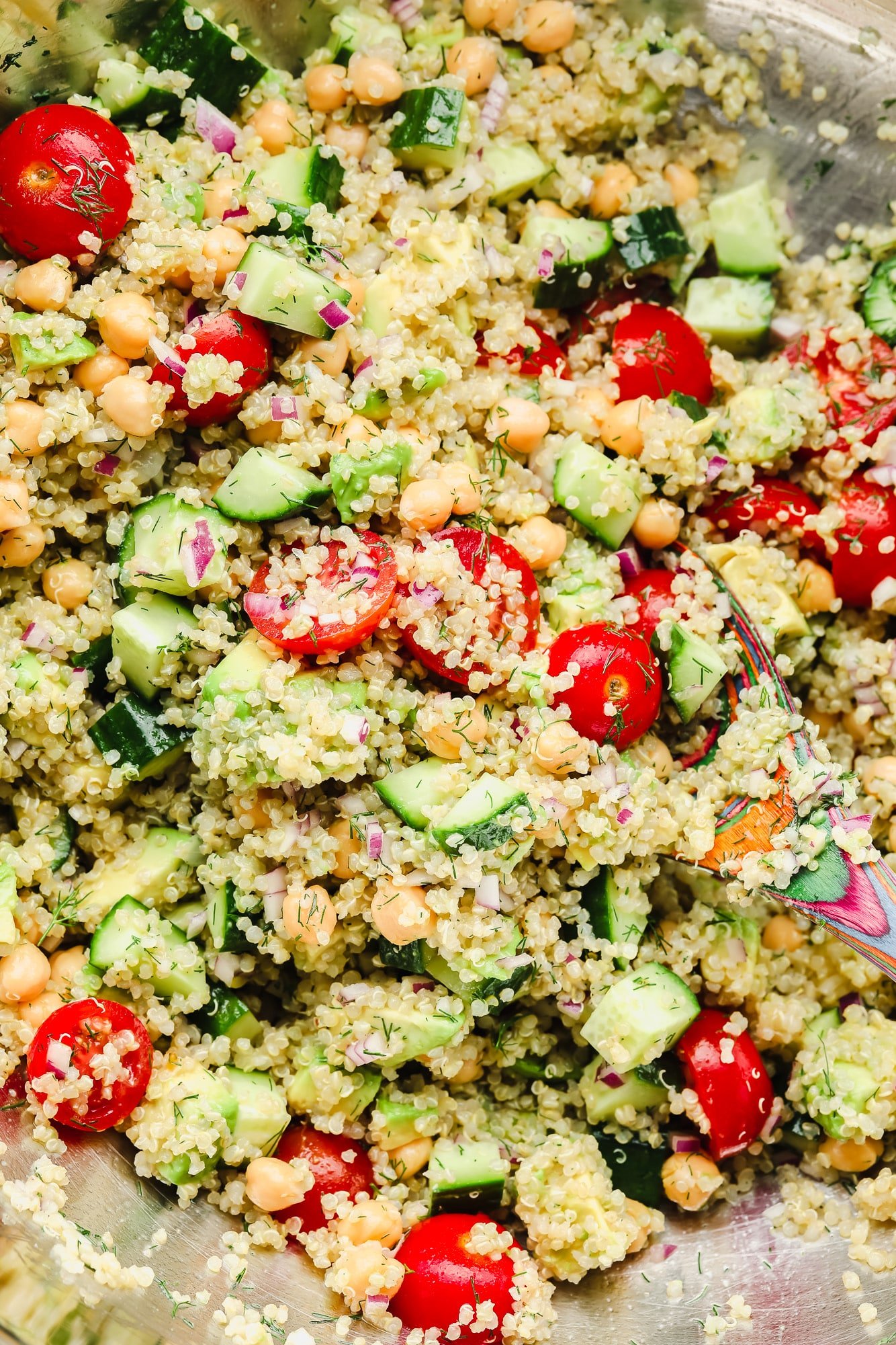 quinoa salad with chickpeas and vegetables in a large bowl.