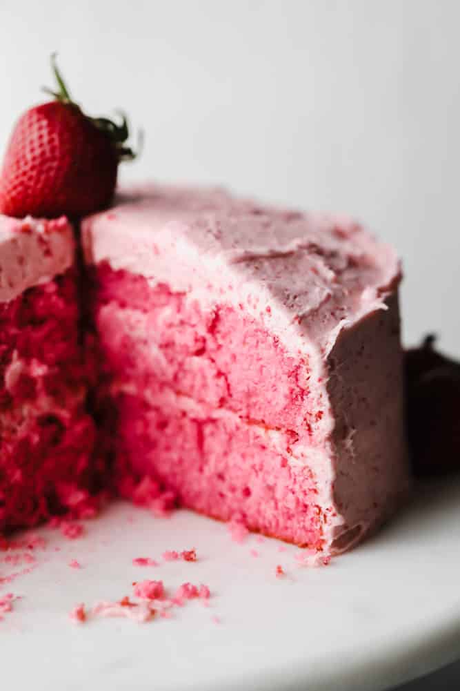 slice of cake taken out of a vegan strawberry cake