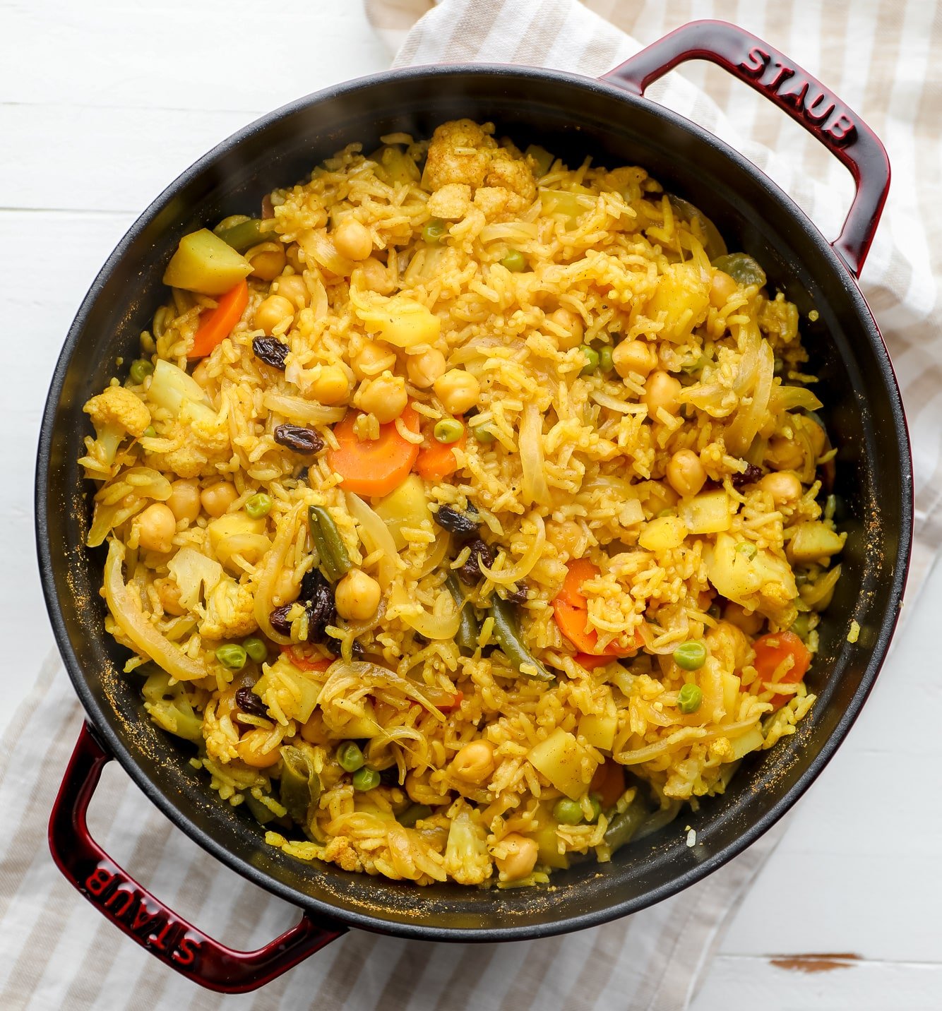 Cooked vegan biryani in a large black pot.