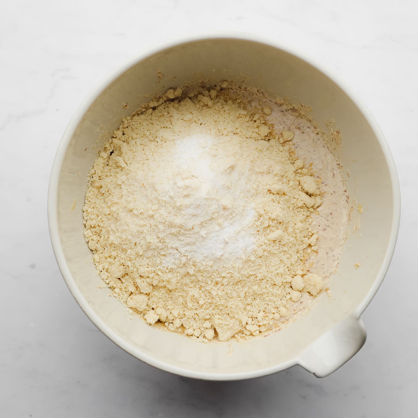 dry ingredients for almond flour cookies in a large white bowl.