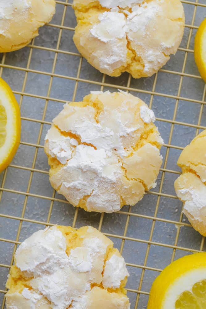 yellow crinkle cookie with powdered sugar and grey background