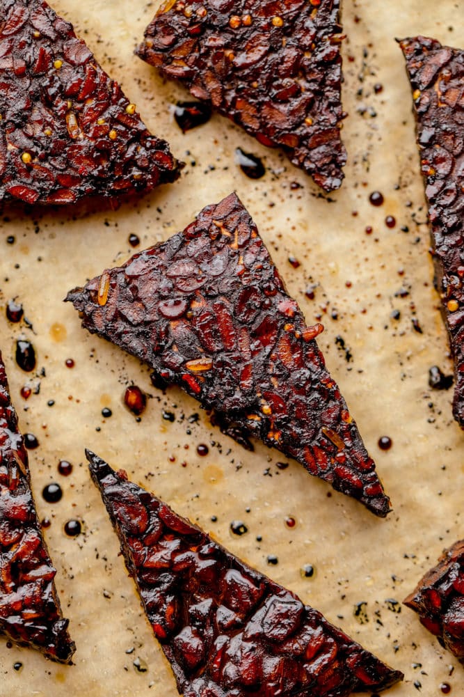 close up of a meaty looking triangle that has been baked on parchment paper