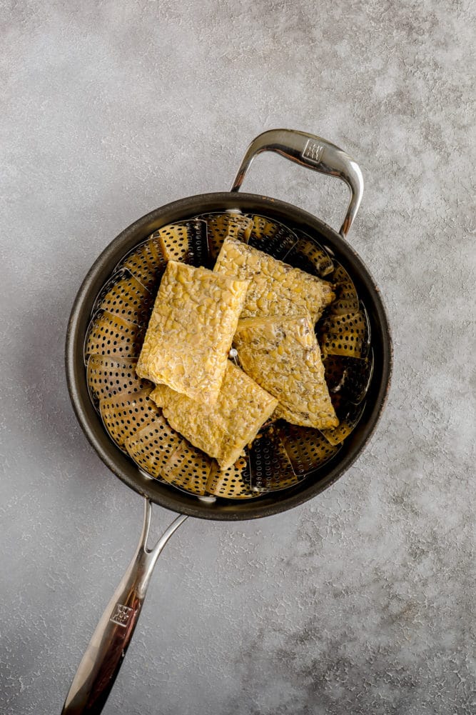 steamed tempeh in pot with basket