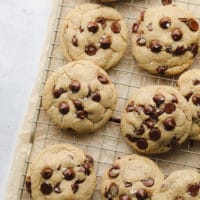 marble background with a cooling rack with lots of cookies