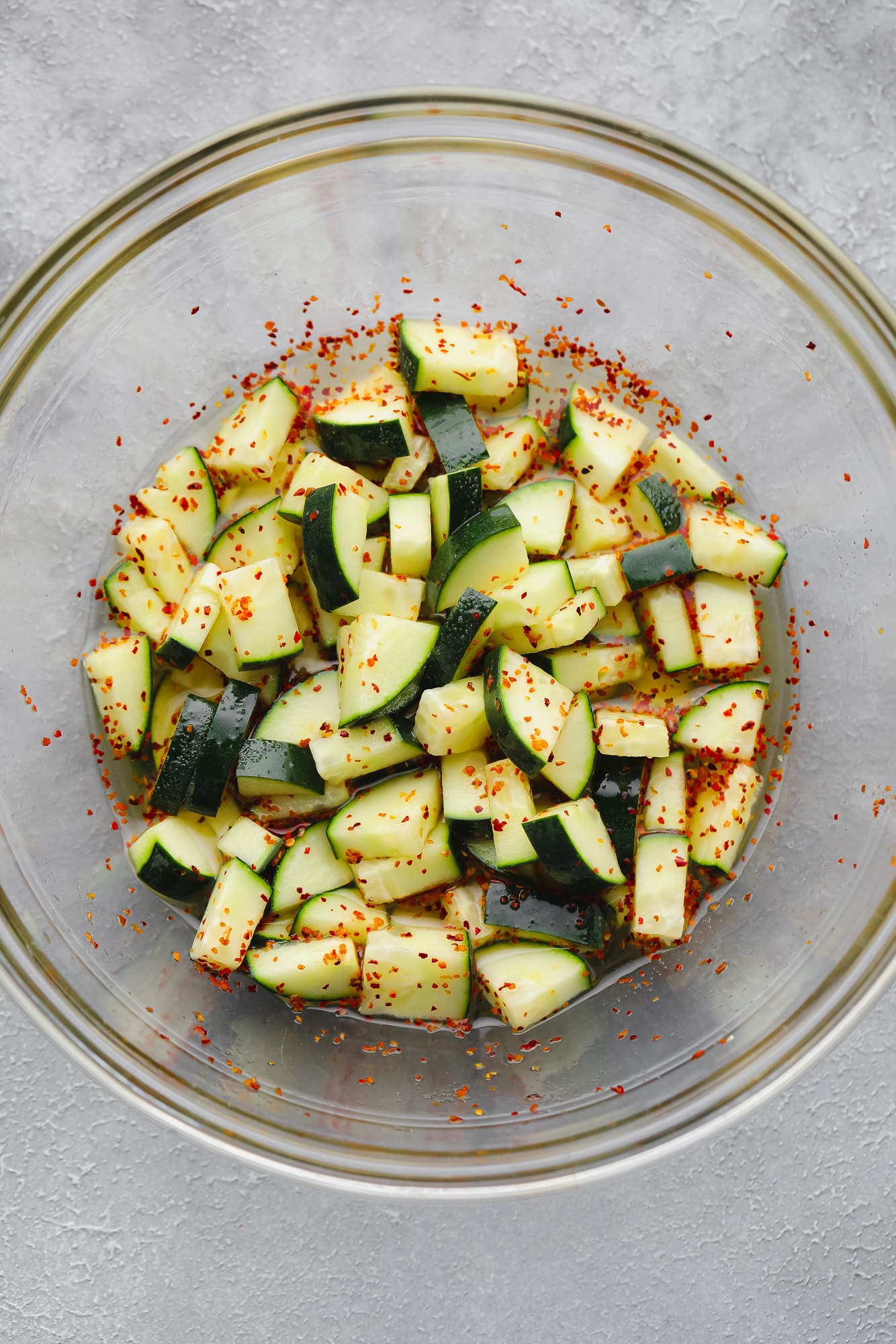 cucumber salad in a large glass bowl.