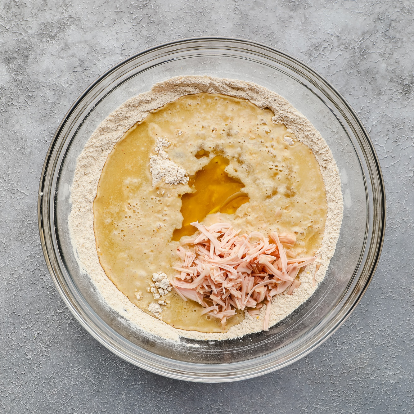 vegan wing ingredients mixed together in a glass bowl.