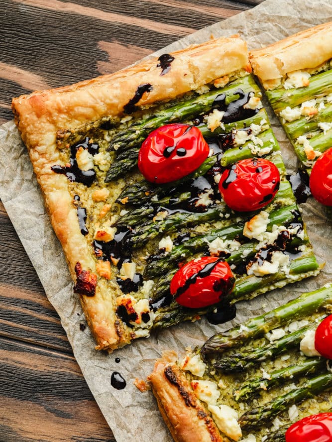 asparagus puff pastry tart with balsamic drizzled on a cut square