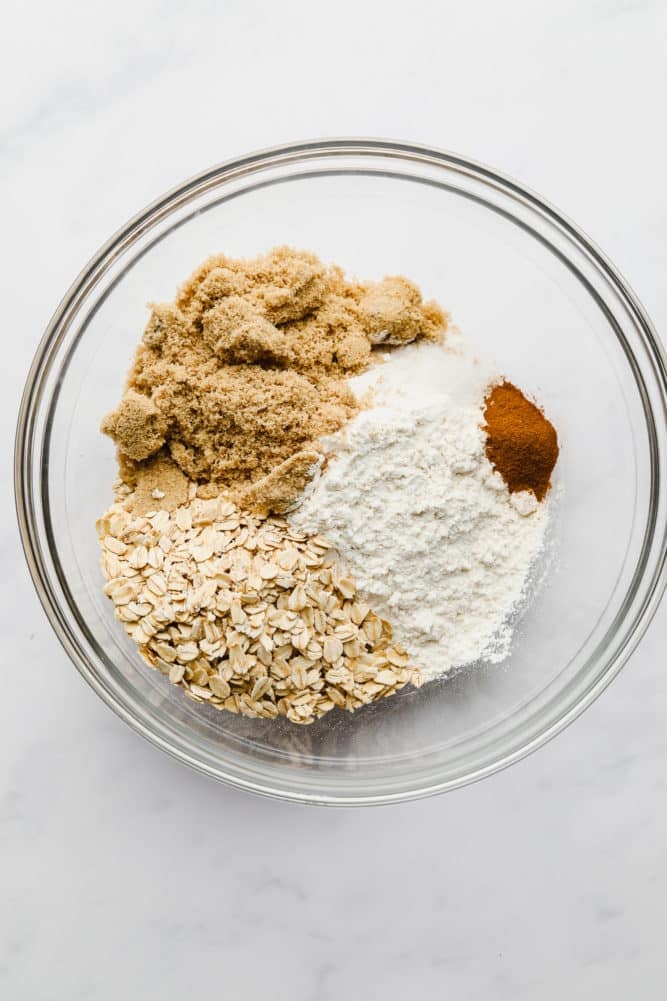 bowl full of oatmeal, flour, brown sugar and cinnamon