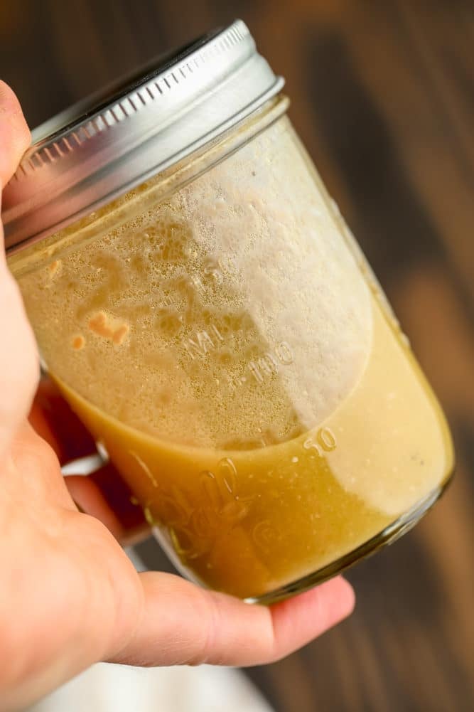 dressing being shaken in a mason jar