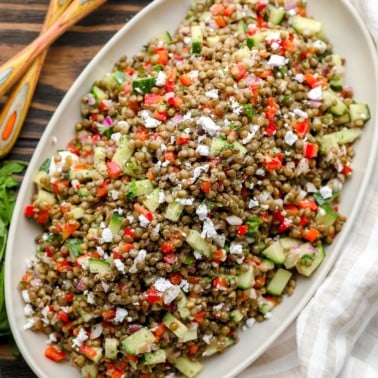 square image of lentil salad on a oval plate