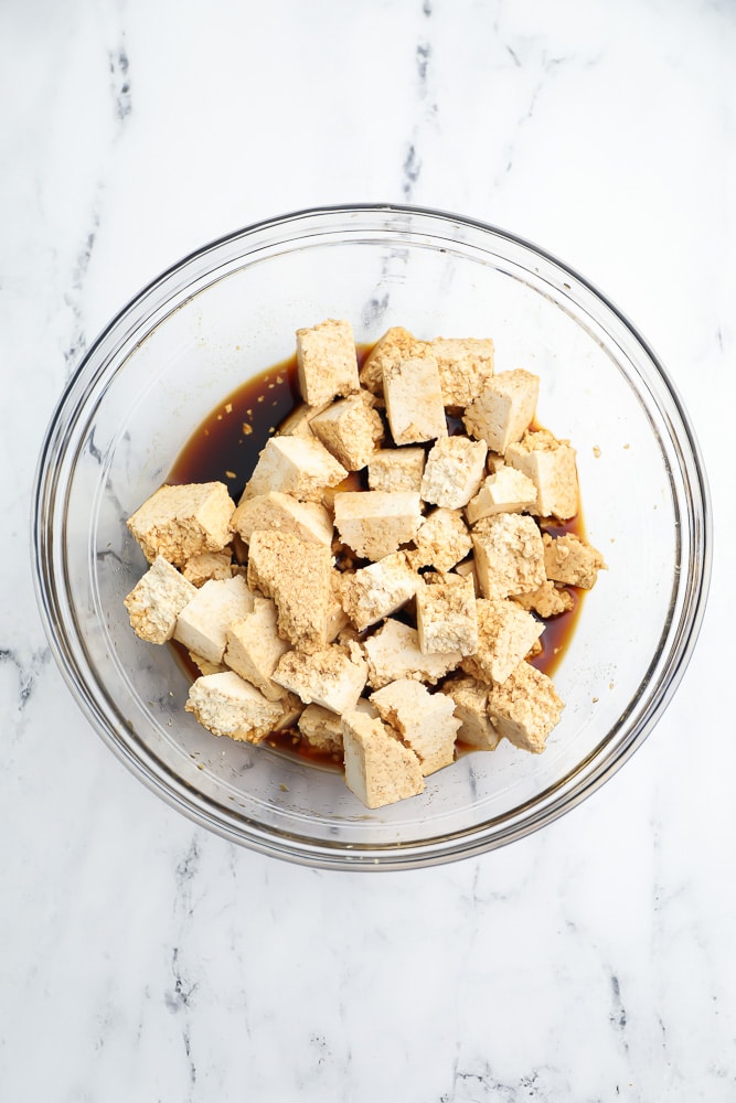 bowl with tofu chunks and soy sauce