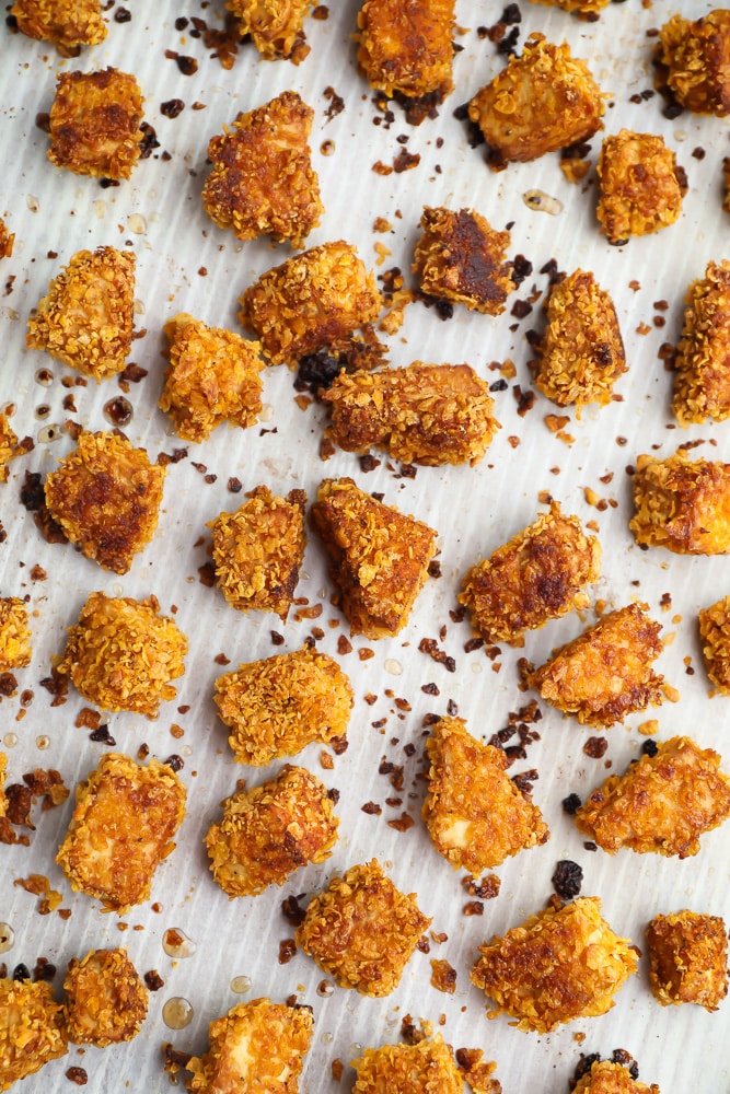 cooked crispy vegan chicken nuggets on parchment lined pan