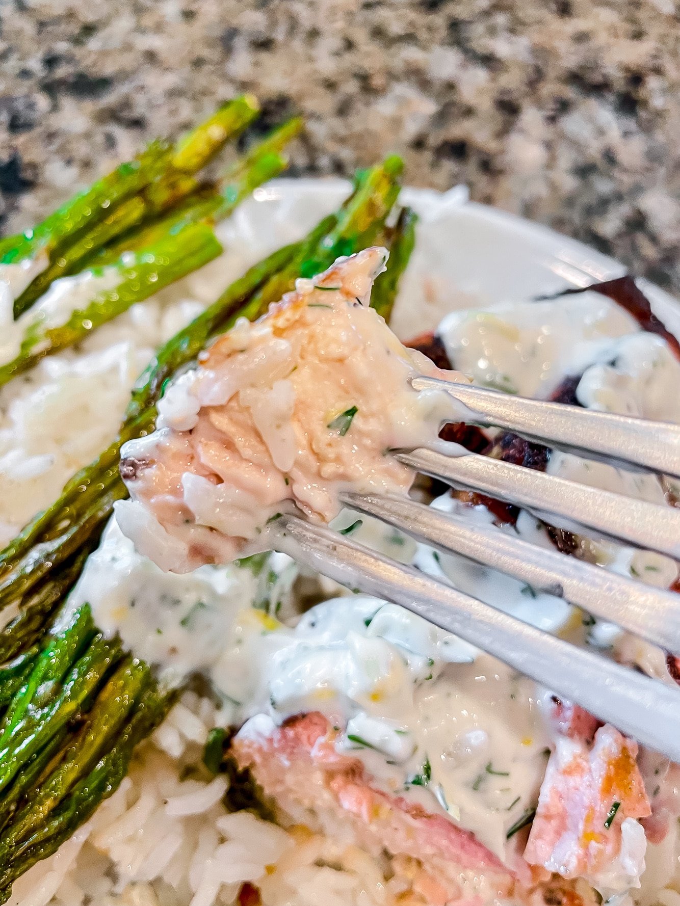 close up on a fork holding a bite of vegan salmon.