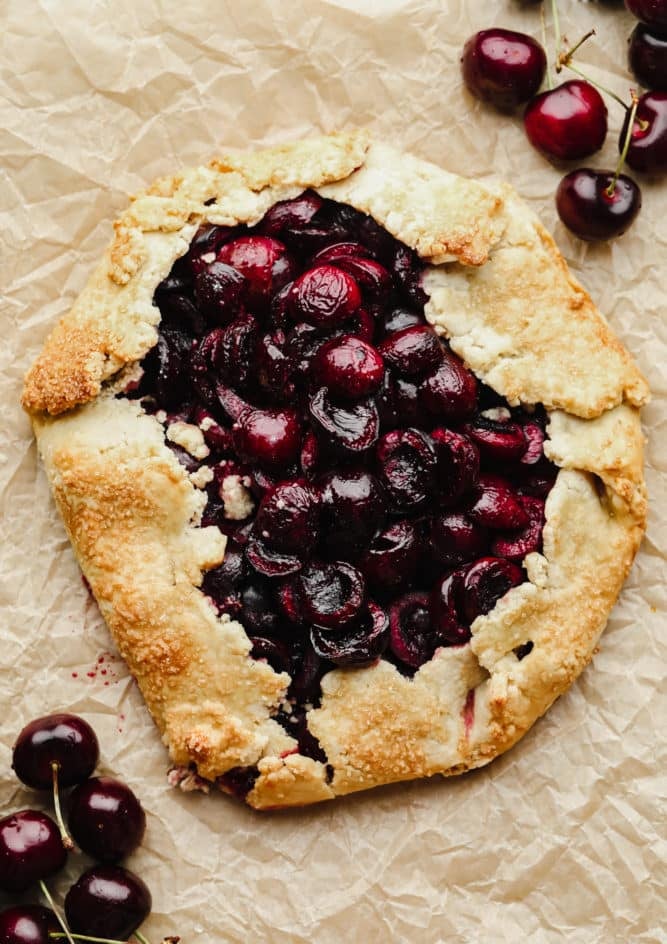 baked cherry galette on crinkled paper