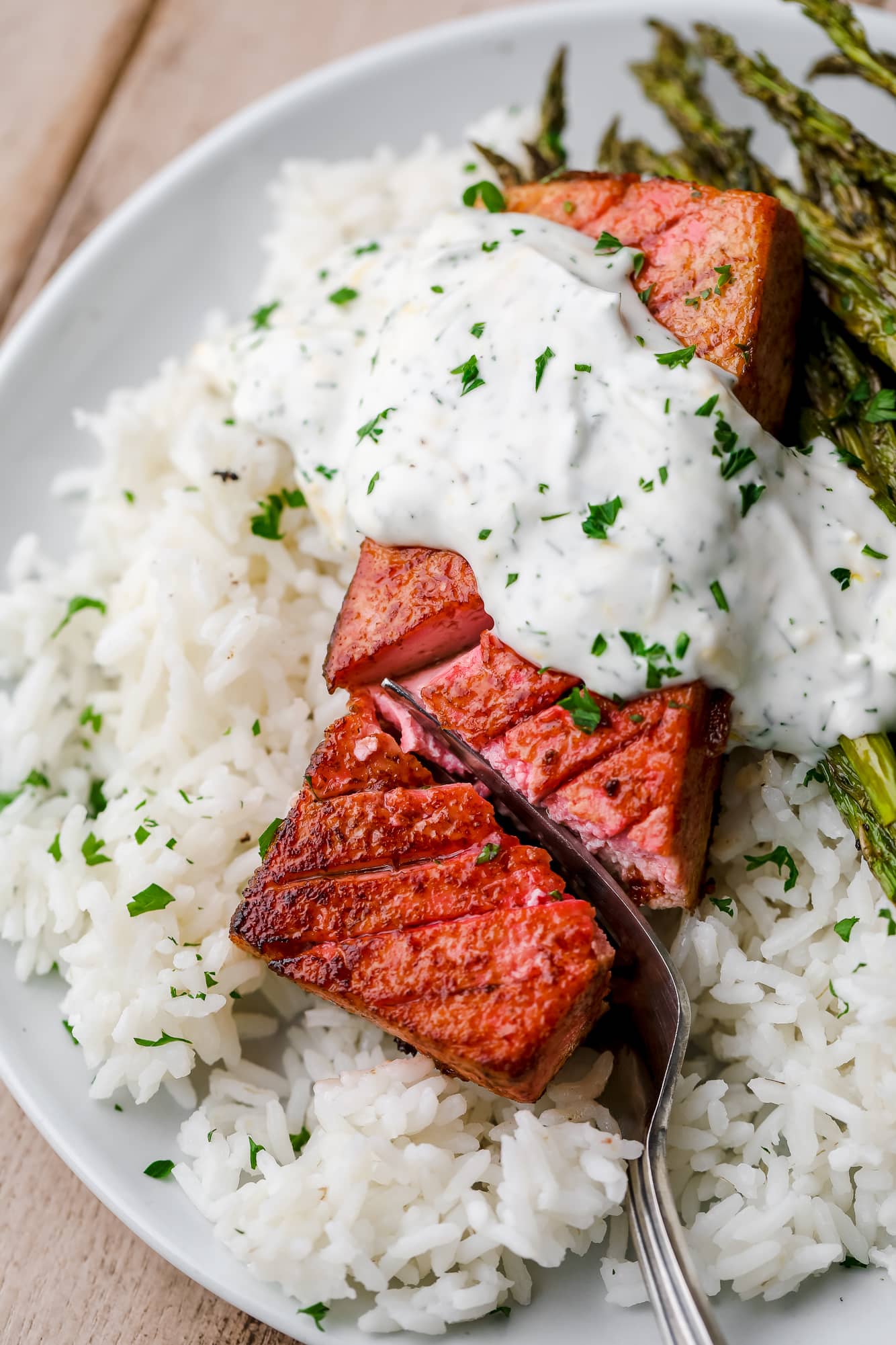 a fork cutting into a piece of vegan salmon.