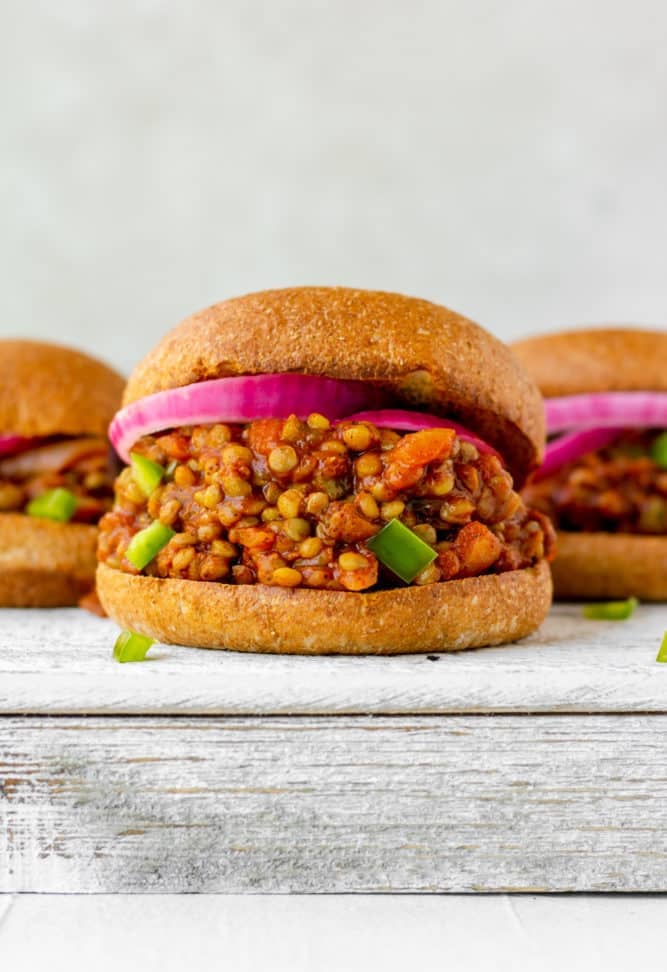 burger in the middle with lentils and onions