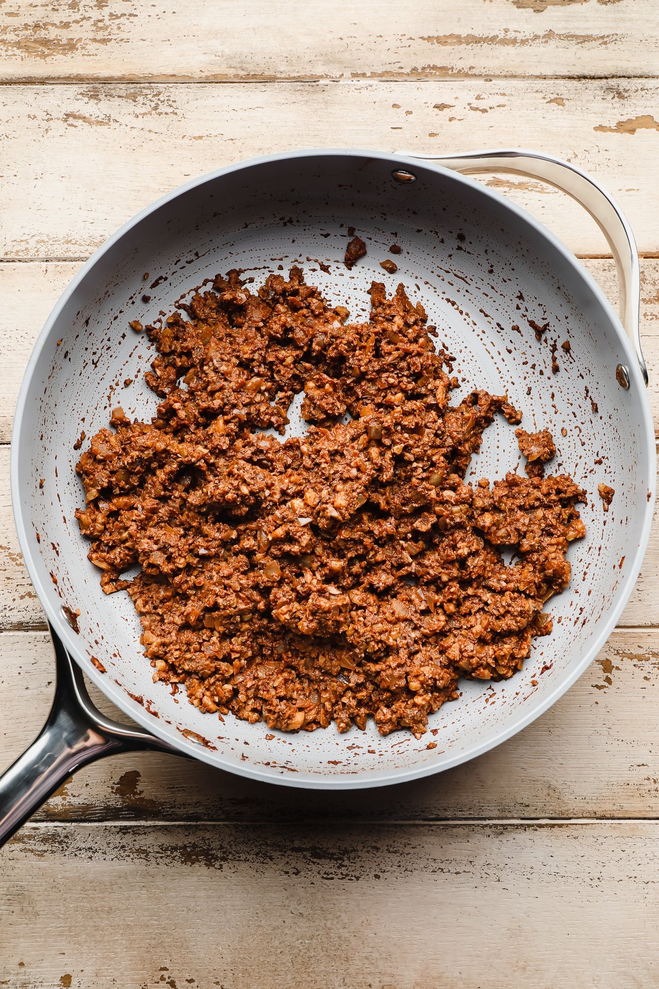 cooked vegan taco meat in a large grey pan.