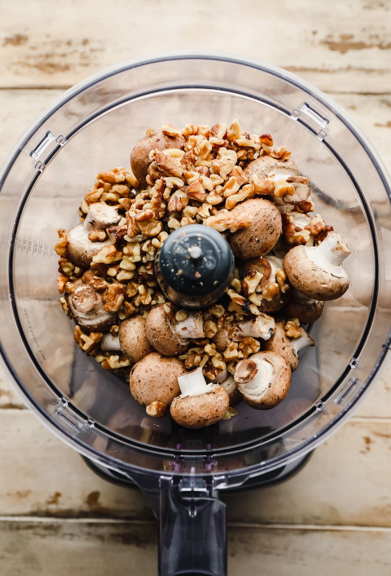 mushrooms and walnuts in a food processor.