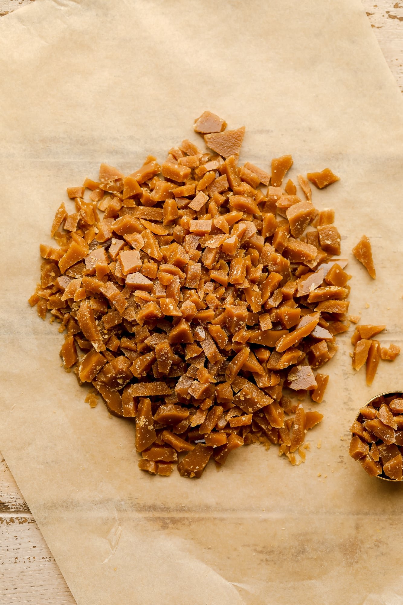 vegan toffee bits on a piece of parchment paper.