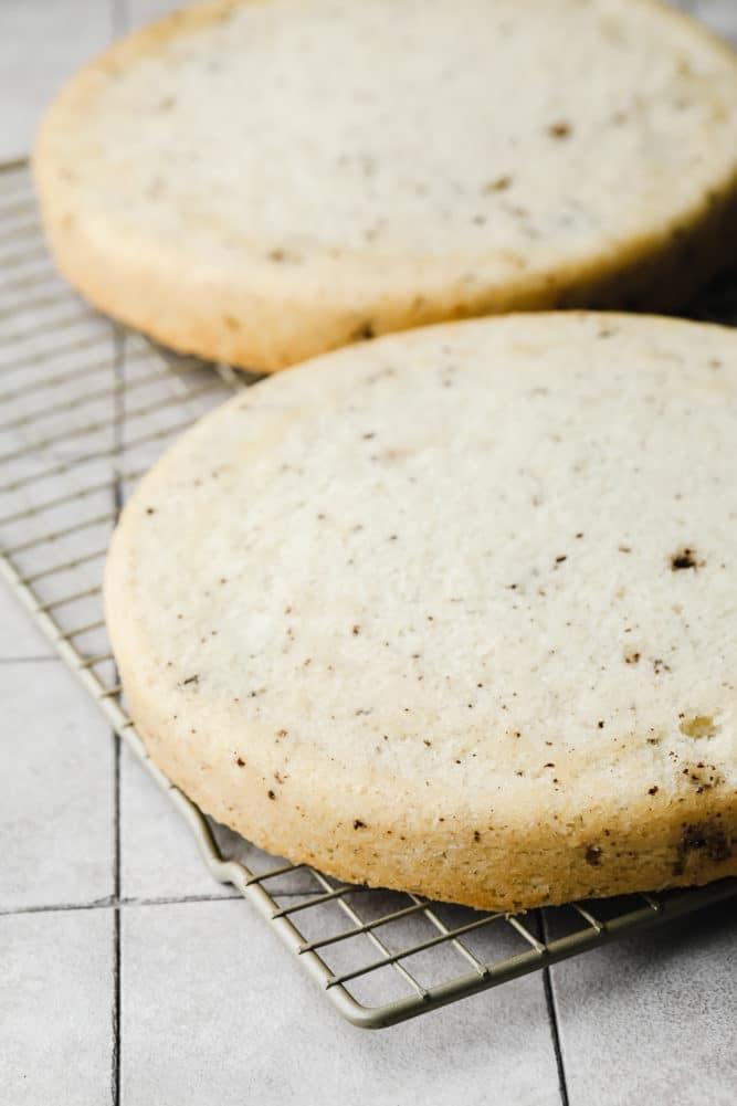 baked vanilla cookie cakes on cooling rack.