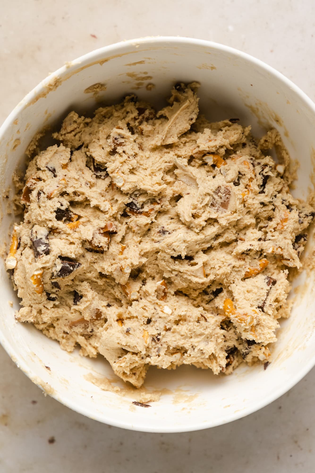 kitchen sink cookie dough mixed together in a white bowl.