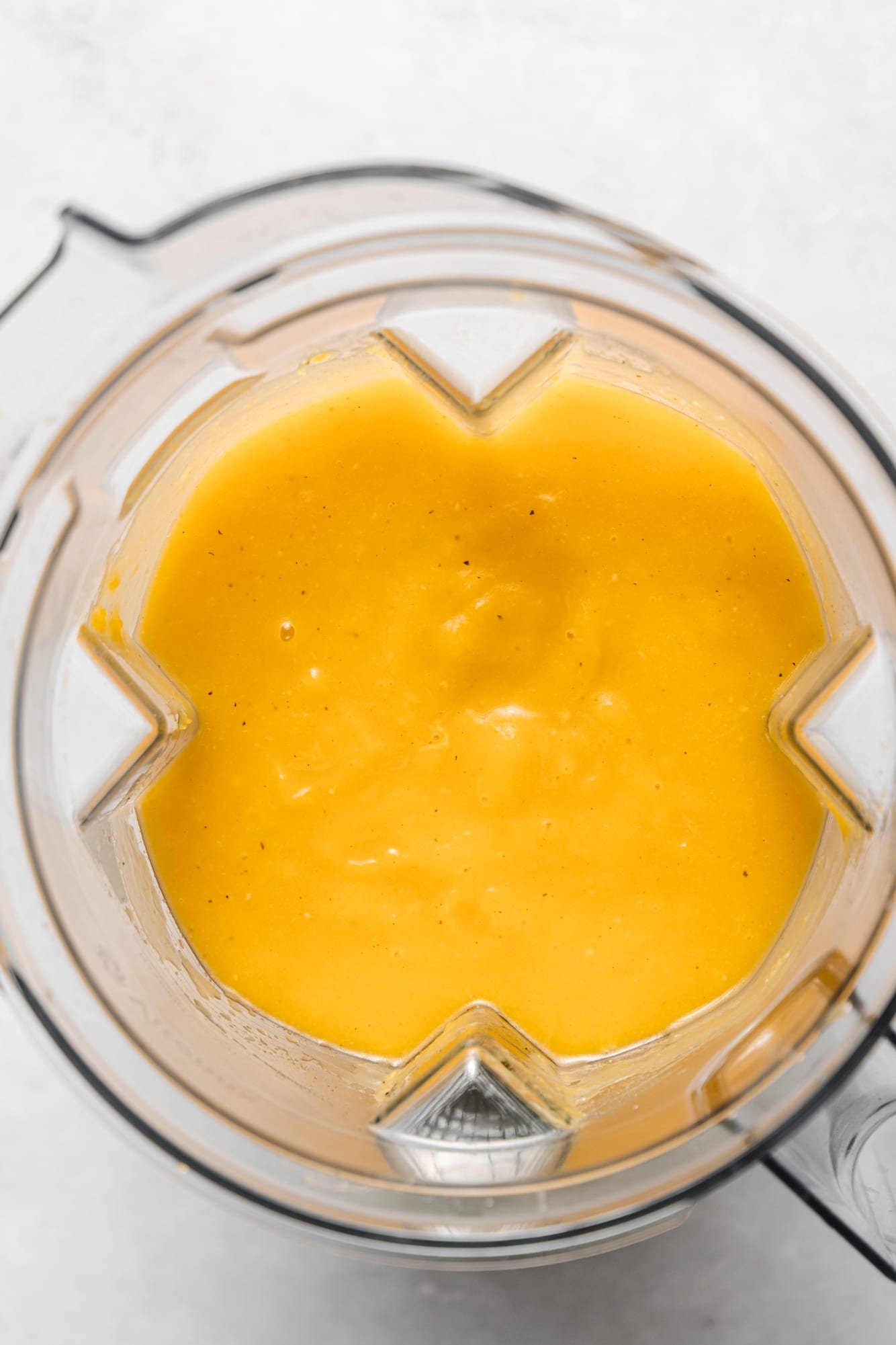 Blended butternut squash soup in a large blender.