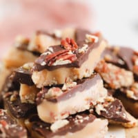 toffee with chocolate and nuts and pink towel in background