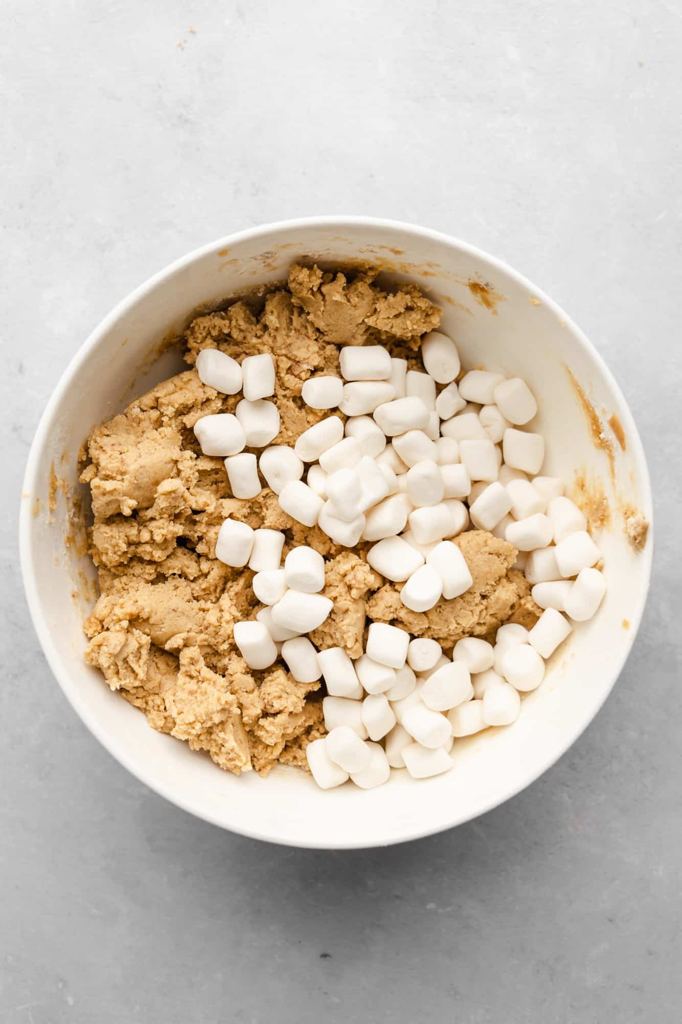 vegan fluffernutter cookie dough with mini marshmallows in a white bowl.