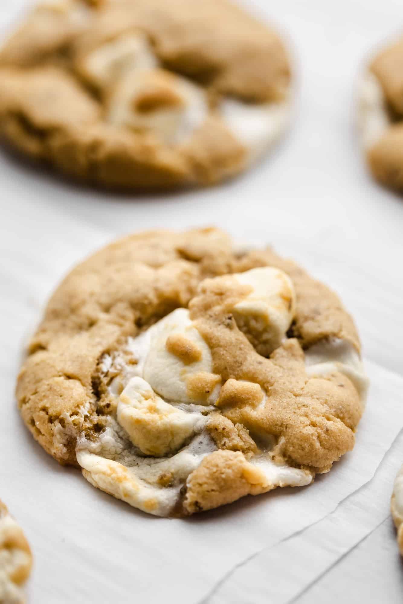 close up on a baked fluffernutter cookie on parchment paper.