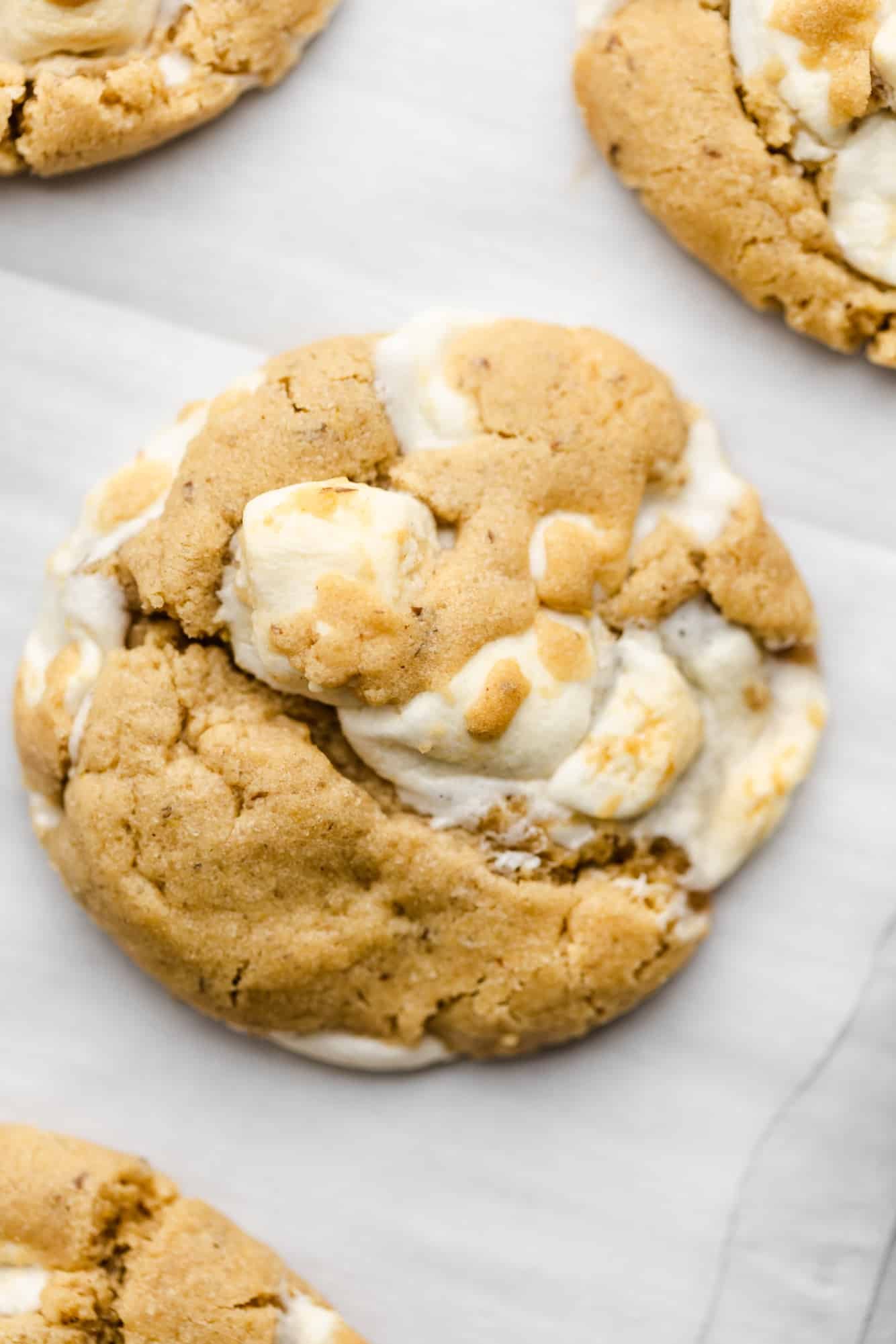 close up on a baked fluffernutter cookie on parchment paper.