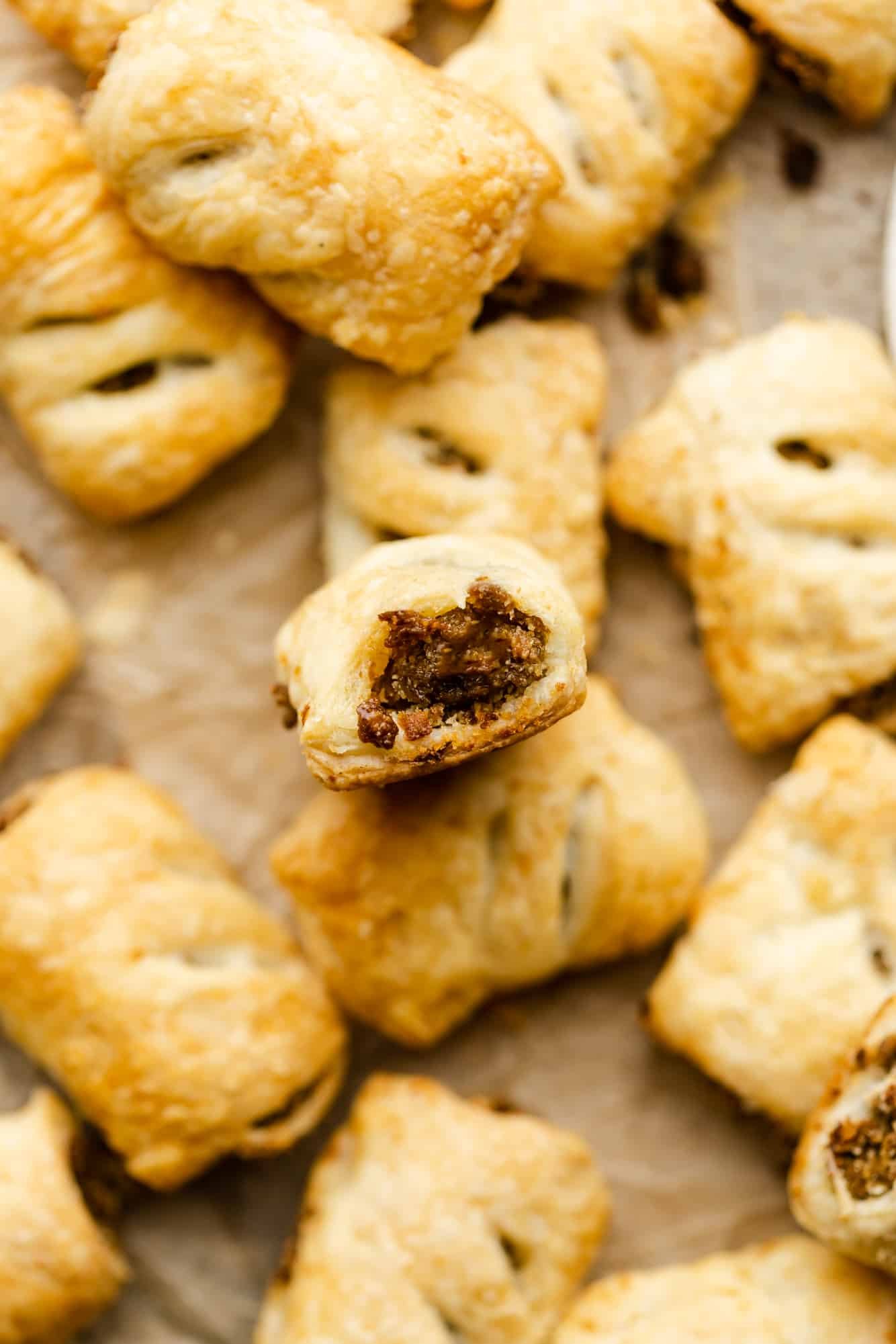 a pile of baked vegan sausage rolls.