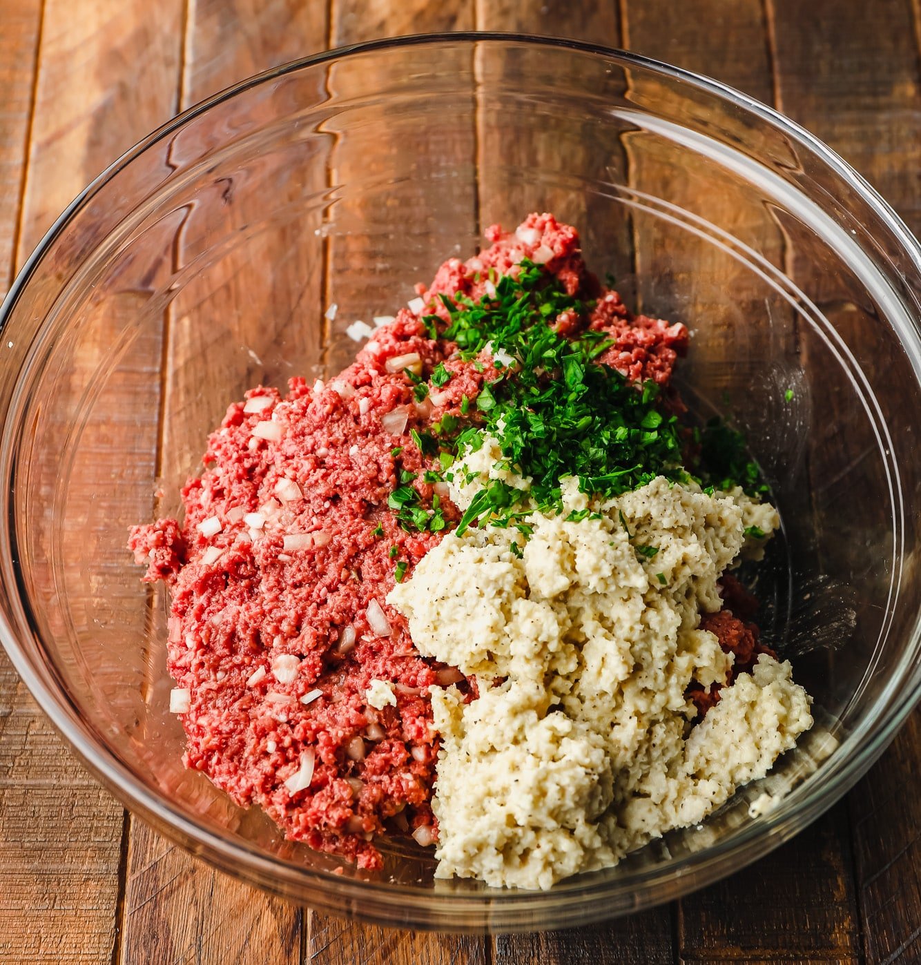 ingredients for vegan meatballs together in a glass bowl.