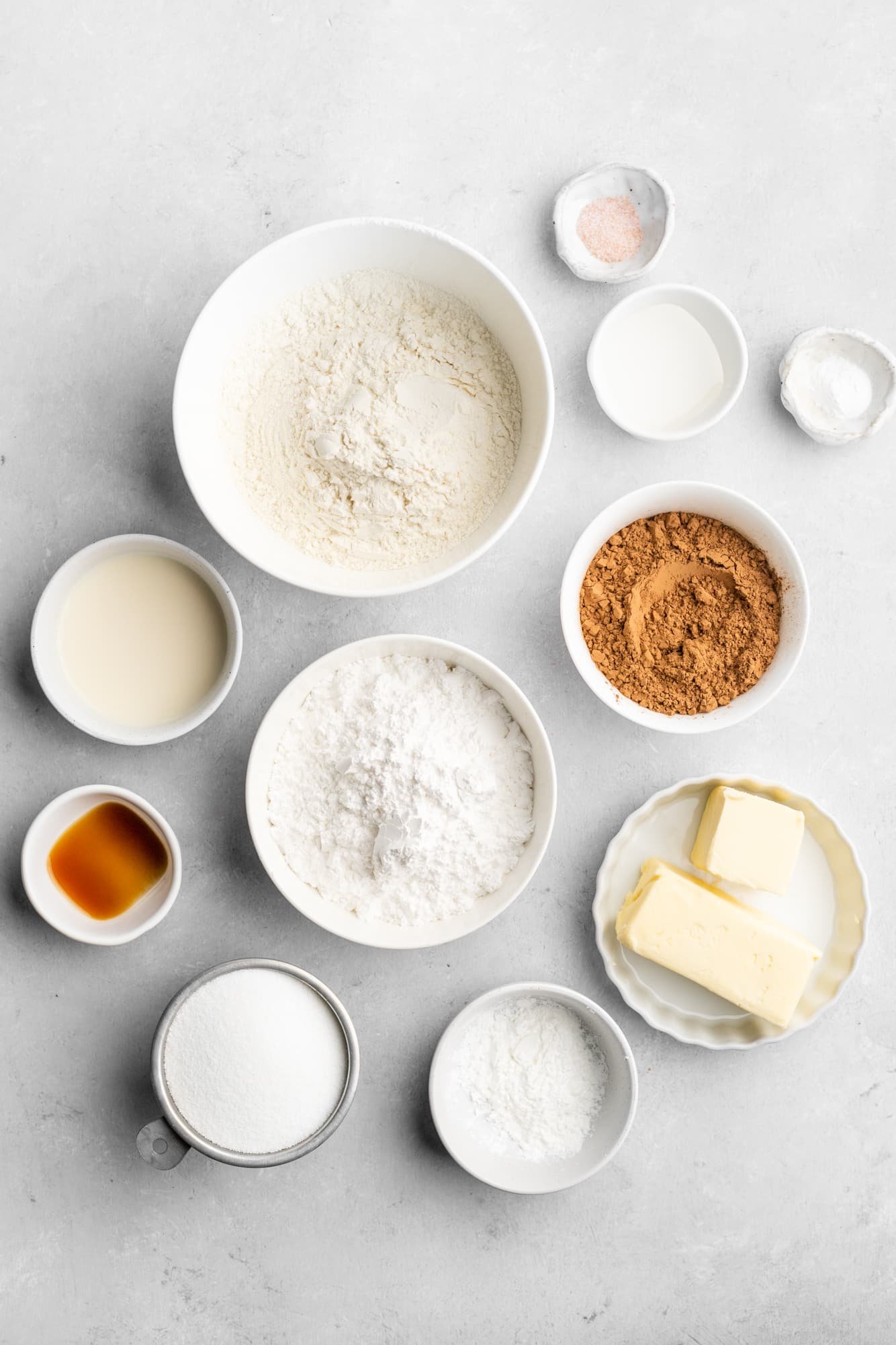 ingredients for Chocolate Sugar Cookies in individual white bowls.