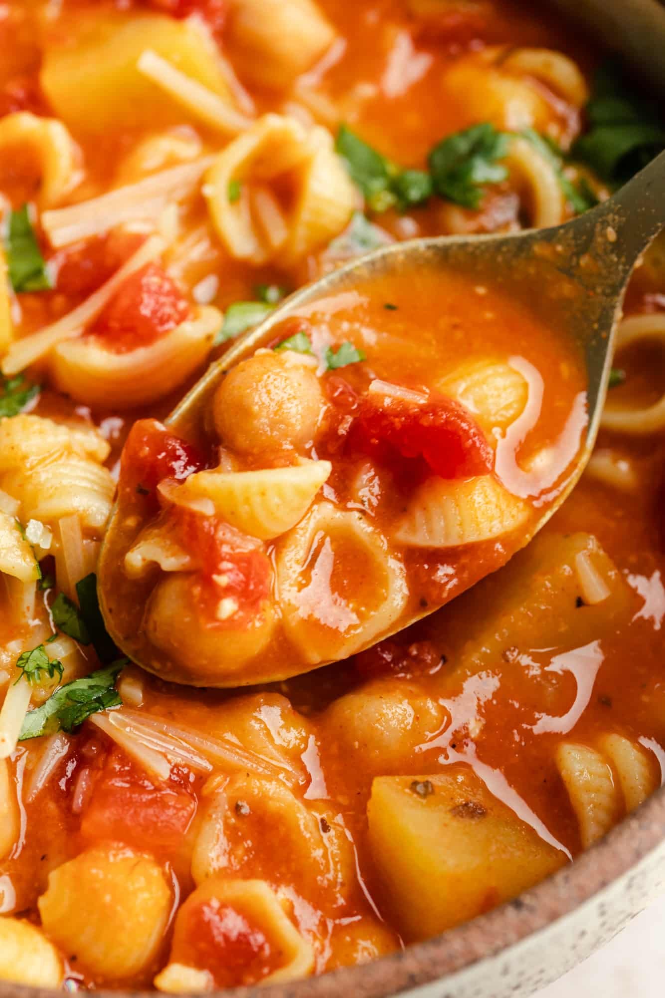 close up on a spoonful of Italian chickpea soup.