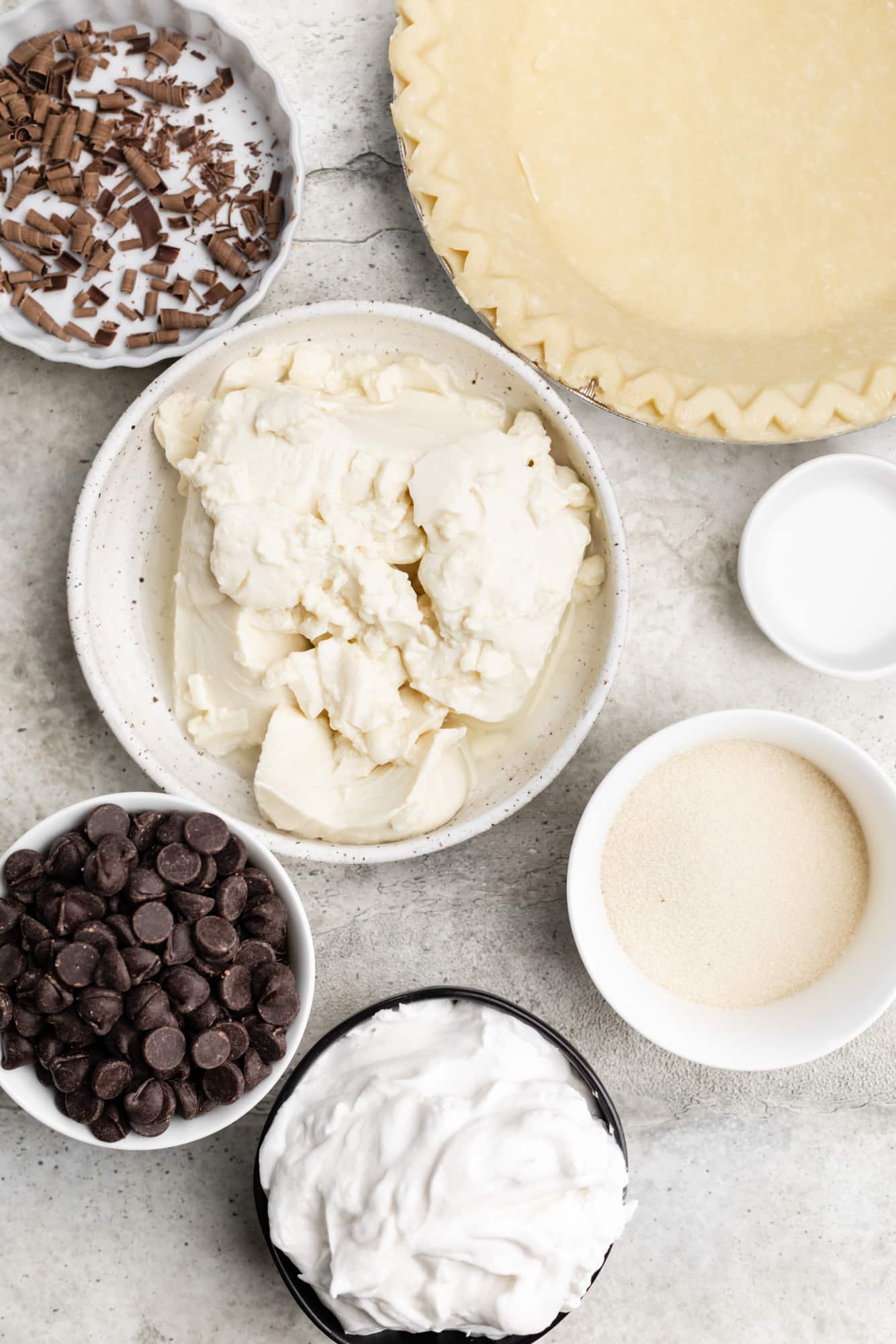 ingredients for vegan chocolate pie in individual white bowls.