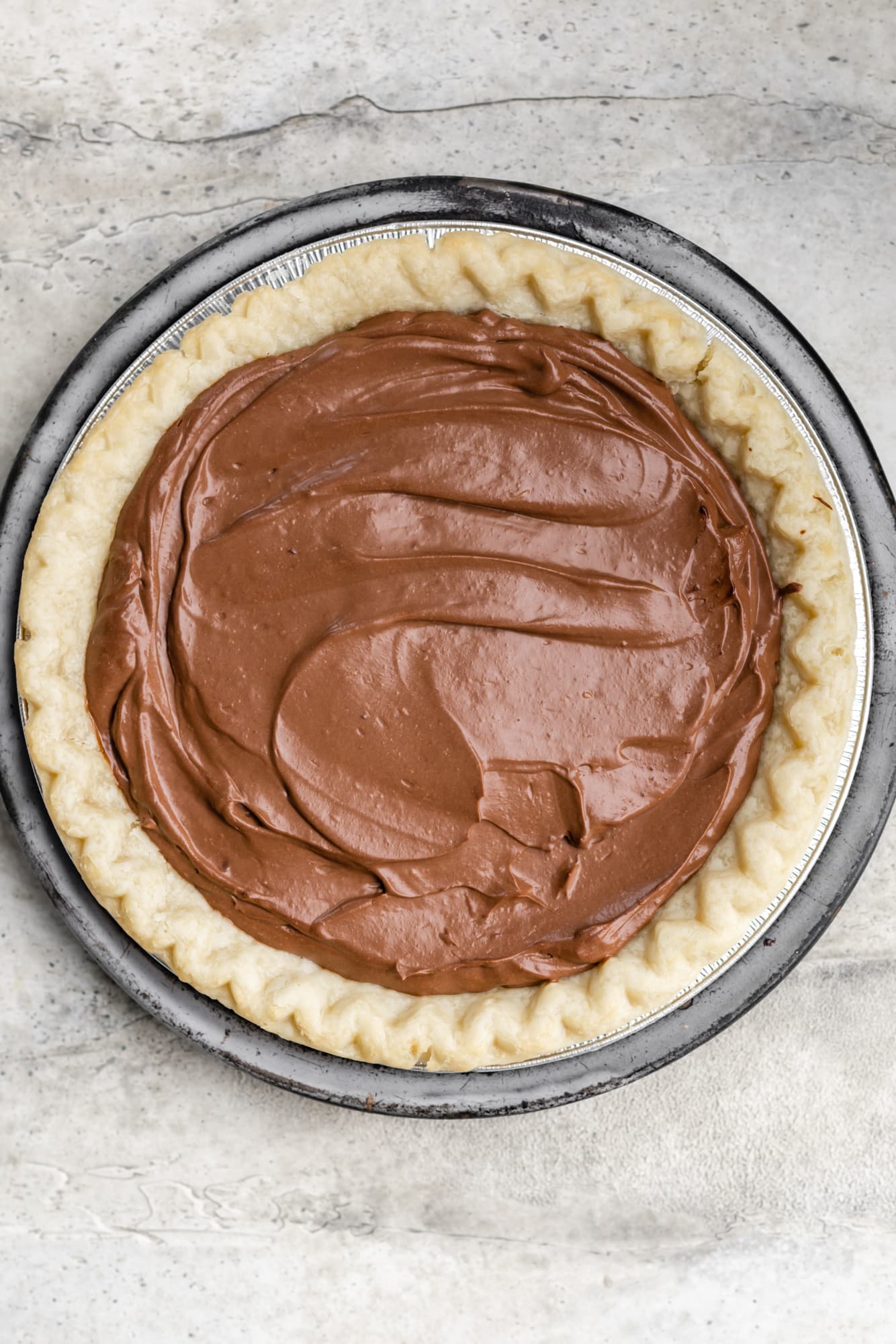 a smooth chocolate mixture in a baked pie shell.
