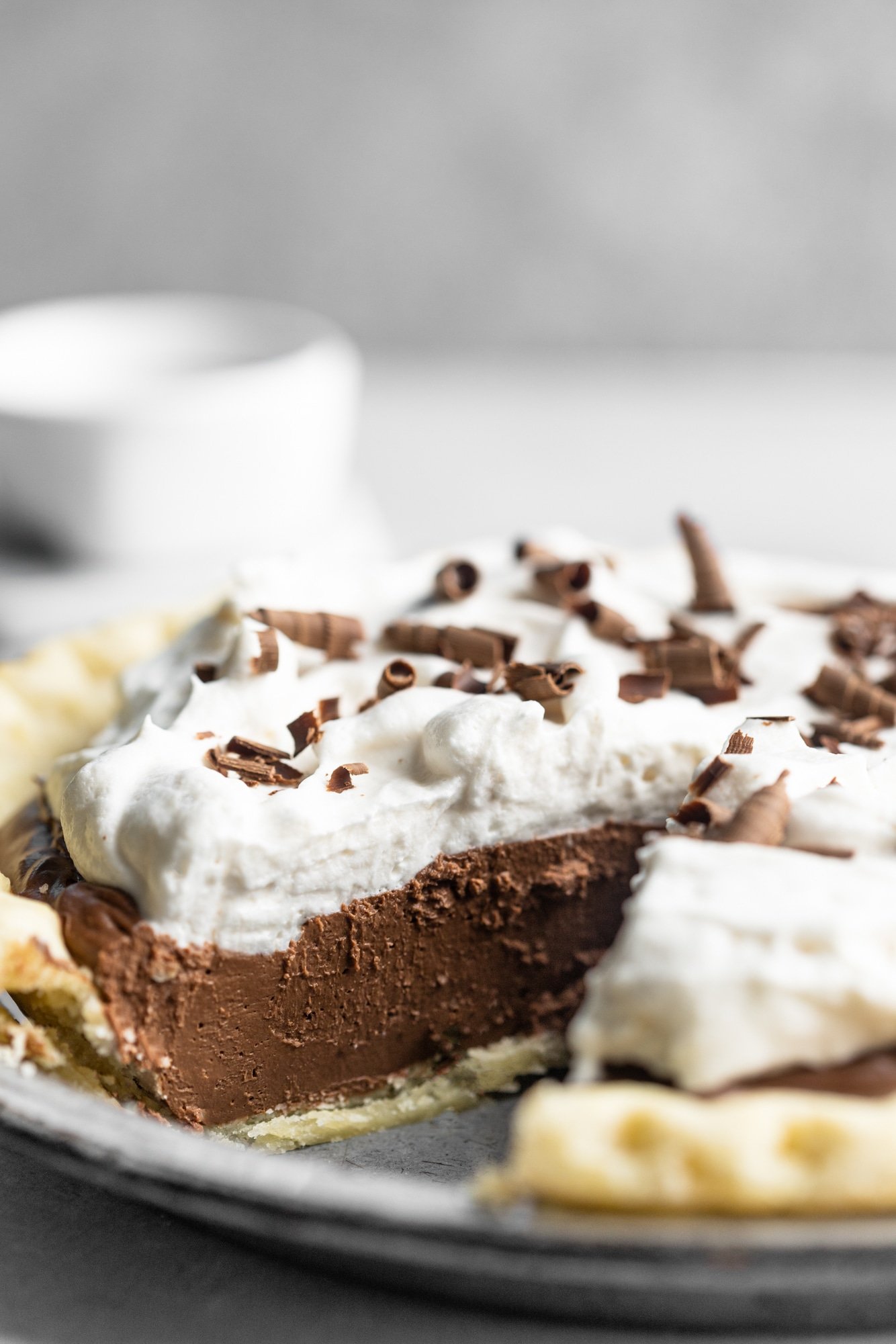 side view of vegan chocolate pie with a slice removed.