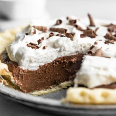 side view of vegan chocolate pie with a slice removed.