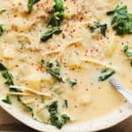 close up on Vegan Zuppa Toscana in a white bowl.