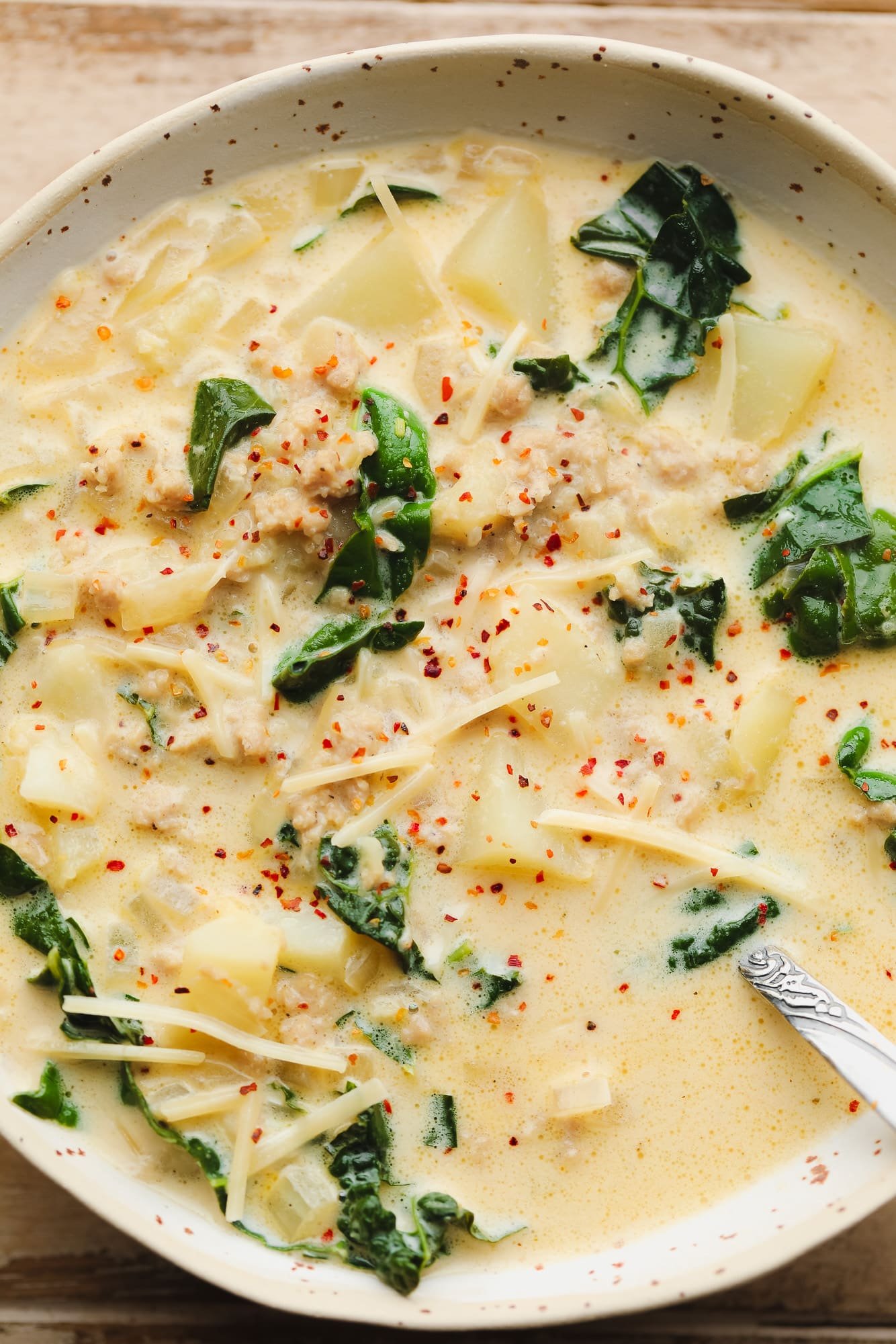 Vegan Zuppa Toscana soup in a white bowl.