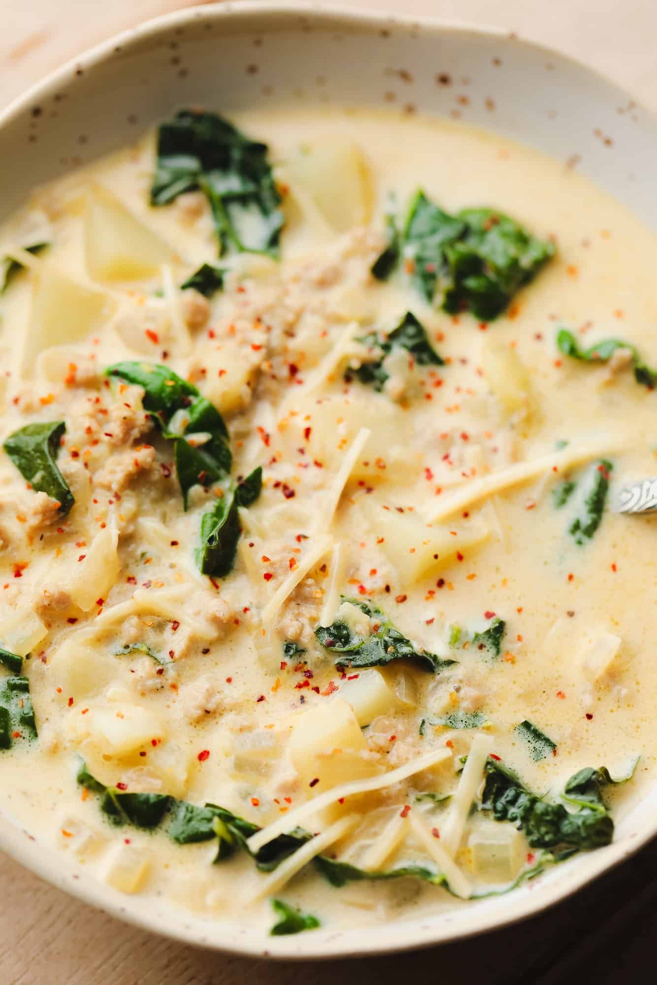 Vegan Zuppa Toscana in a white bowl.