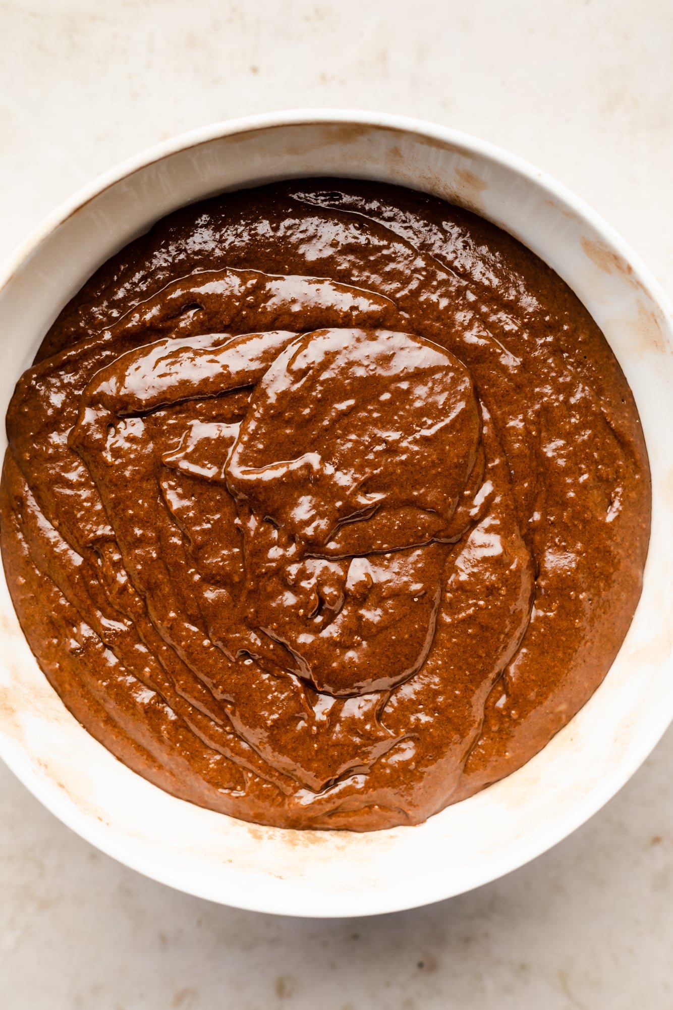 chocolate cake batter in a large white bowl.